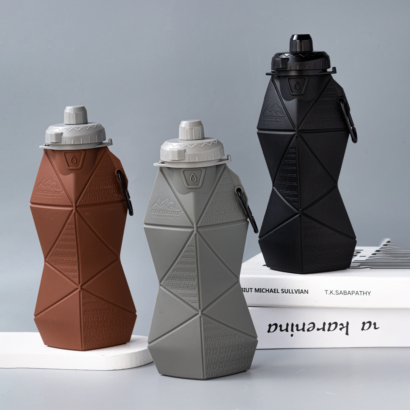 Pink and black foldable silicone water bottle with leakproof lid and convenient retaining strap — view 4