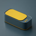 Green portable ultrasonic cleaner machine for jewellery and glasses crafted from durable ABS plastic.