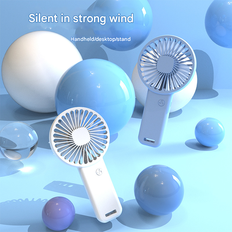 Two white portable mini handheld fans with desktop base and integrated phone stand — view 2