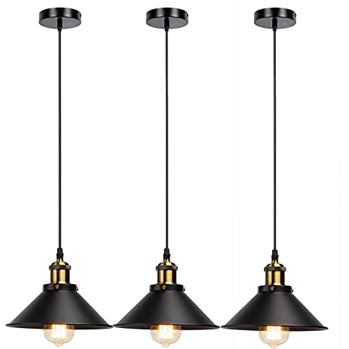 Three black industrial metal pendant lights hanging over a dining table with vintage Edison bulbs. — view 5