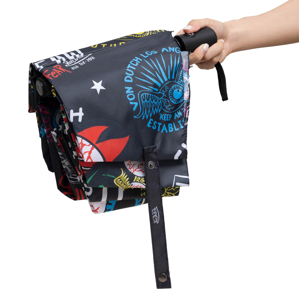 Black compact automatic travel umbrella with ergonomic handle, protective sleeve, and bold street style graphics — view 4