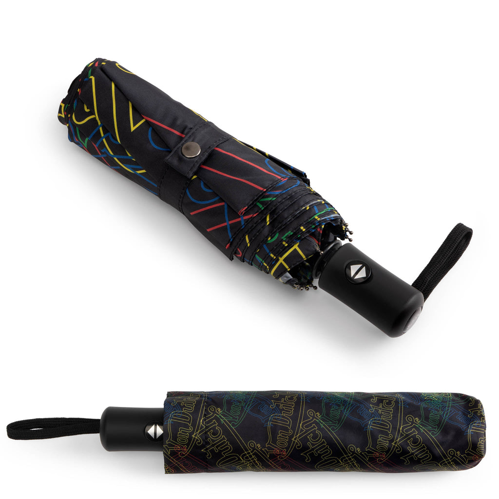 Compact automatic travel umbrella with bold neon graphic print, ergonomic handle, and matching protective sleeve — view 5