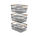 Three black metal wire organizer bin baskets with wooden bamboo handles for home storage