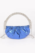 PYRAMIDE metallic crossbody bag with sculptural stone top handle and detachable strap for evening wear.