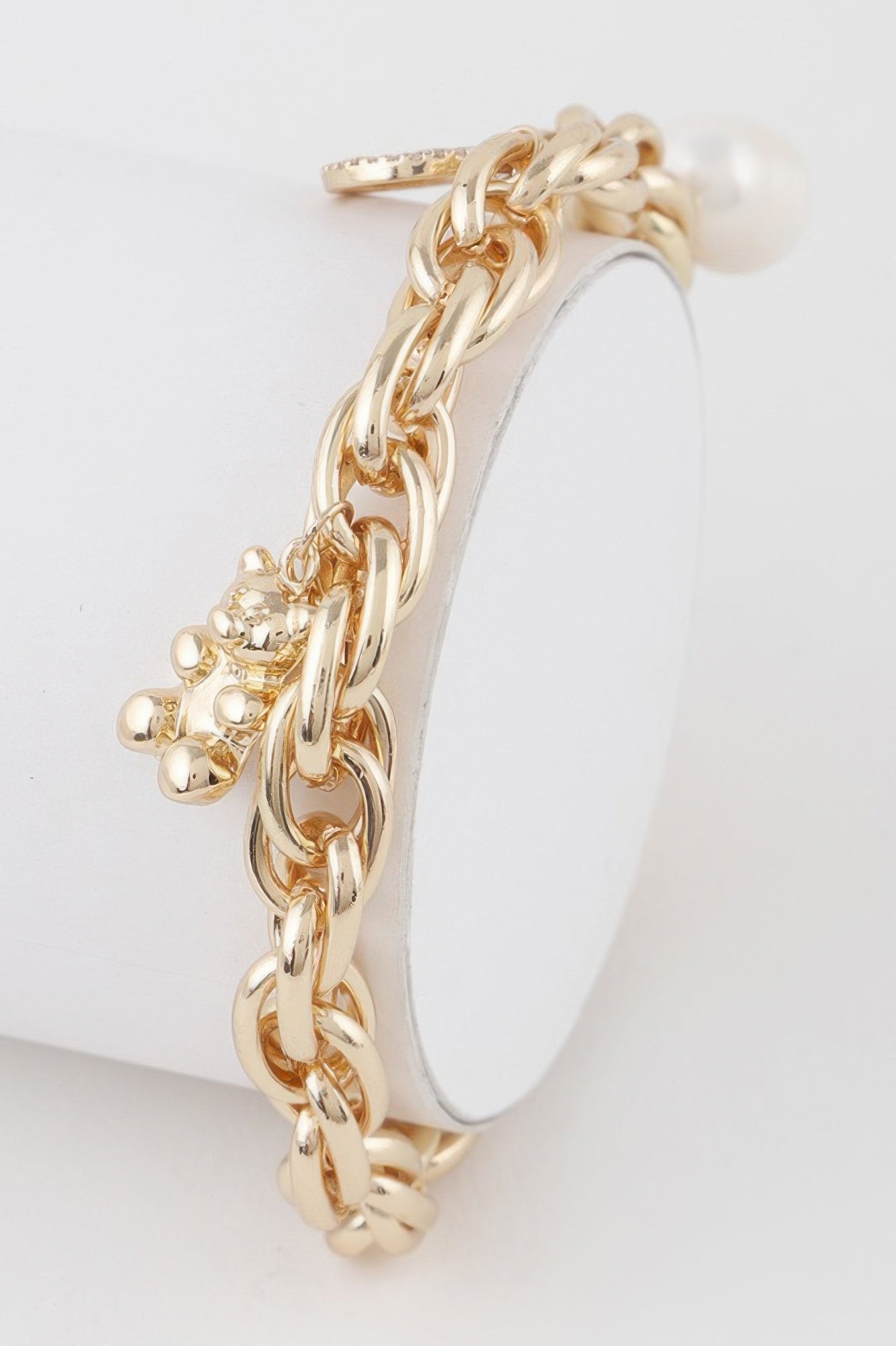 Structured polished metal chain bracelet featuring a charming teddy bear motif for women