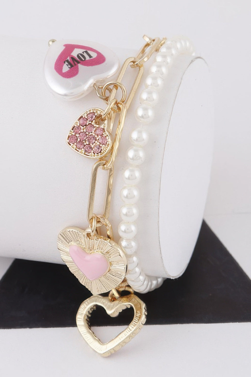 Women's heart charm bracelet in gold and silver cream, lightweight stackable romantic jewelry design. — view 3