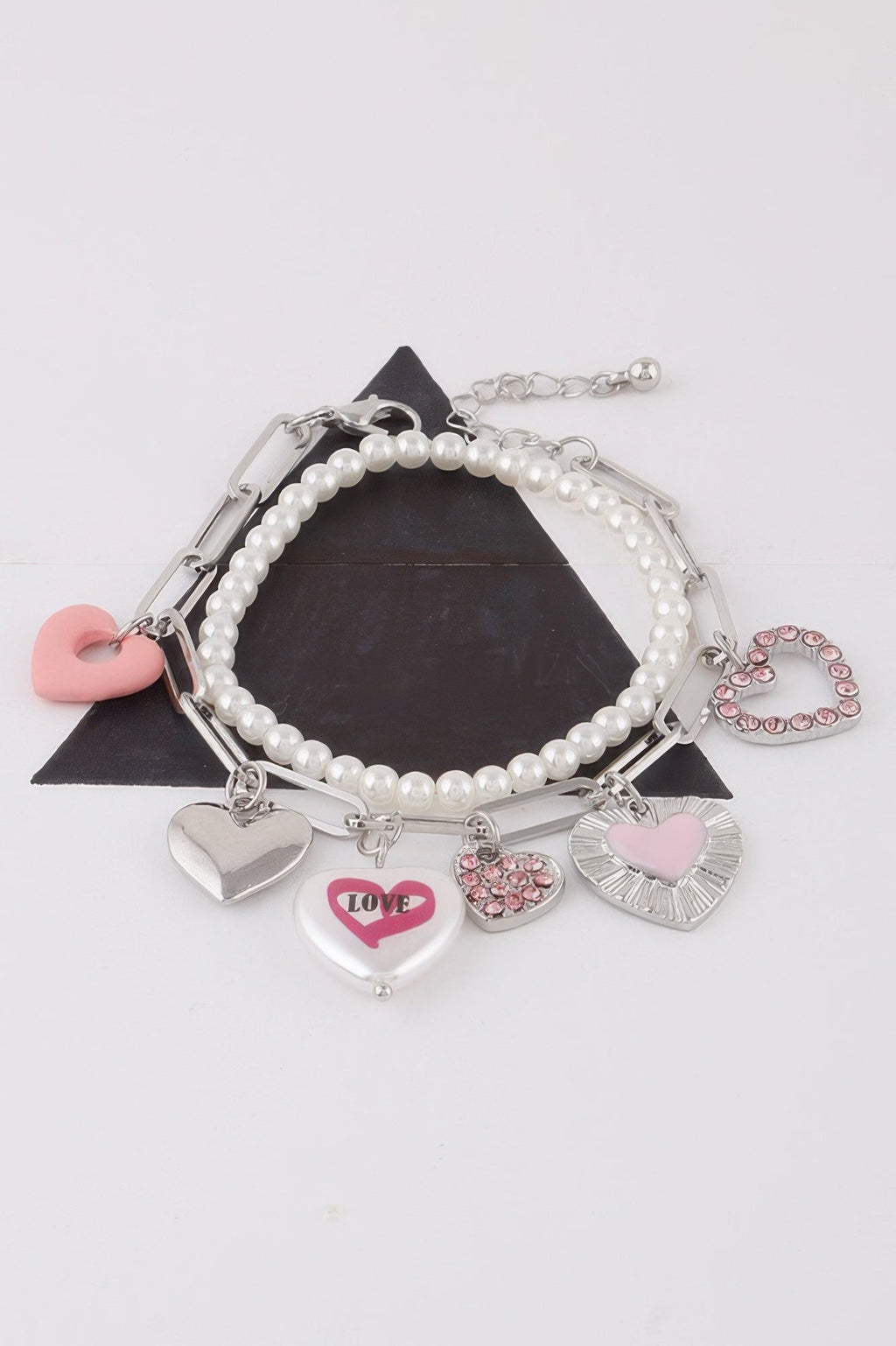 Women's heart charm bracelet in gold and silver cream, lightweight stackable romantic jewelry design. — view 4