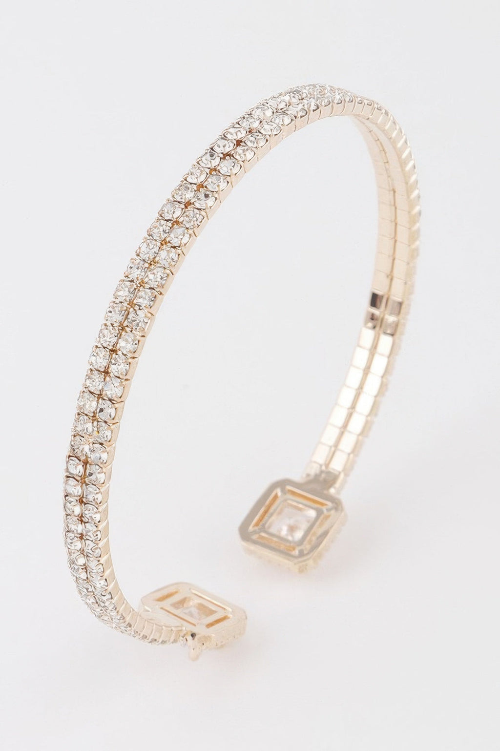 Women's jeweled open cuff bracelet in gleaming metallic finish with sparkling crystal accents
