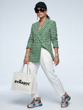 Women's green and cream tweed double-breasted blazer with decorative gold metallic buttons and V-neck.
