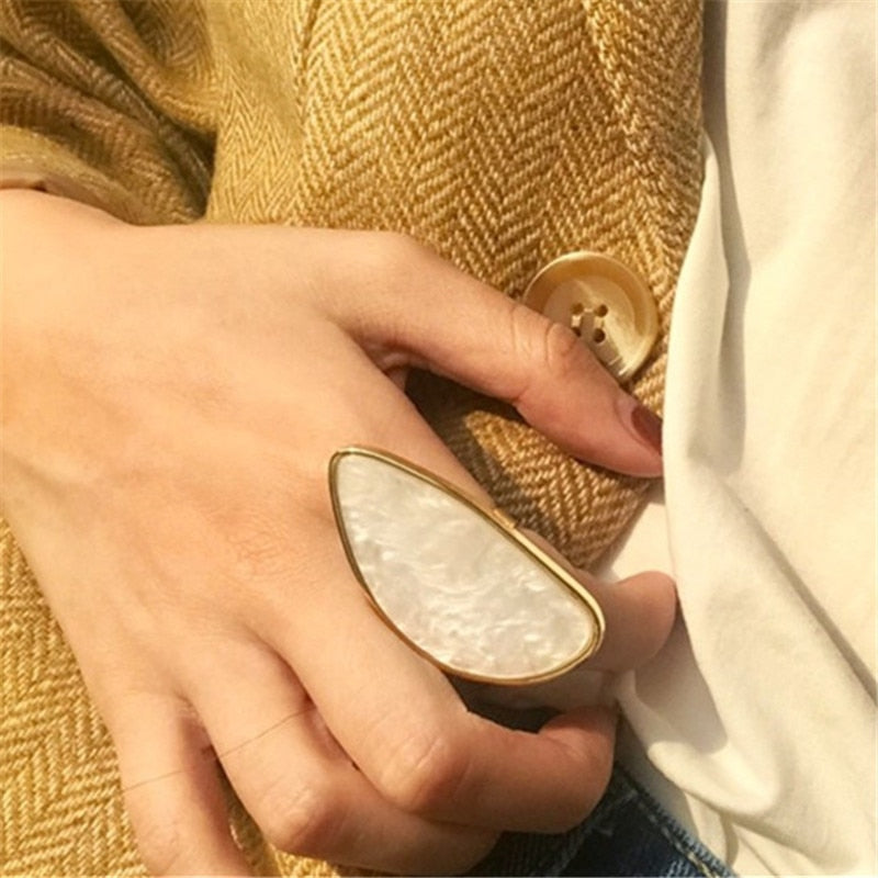 Astor geometric statement ring in marbled white acetate with an adjustable gold-tone band — view 2
