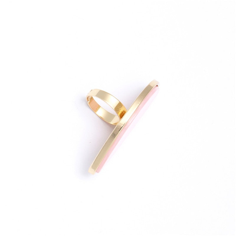 Astor geometric statement ring in marbled white acetate with an adjustable gold-tone band — view 4