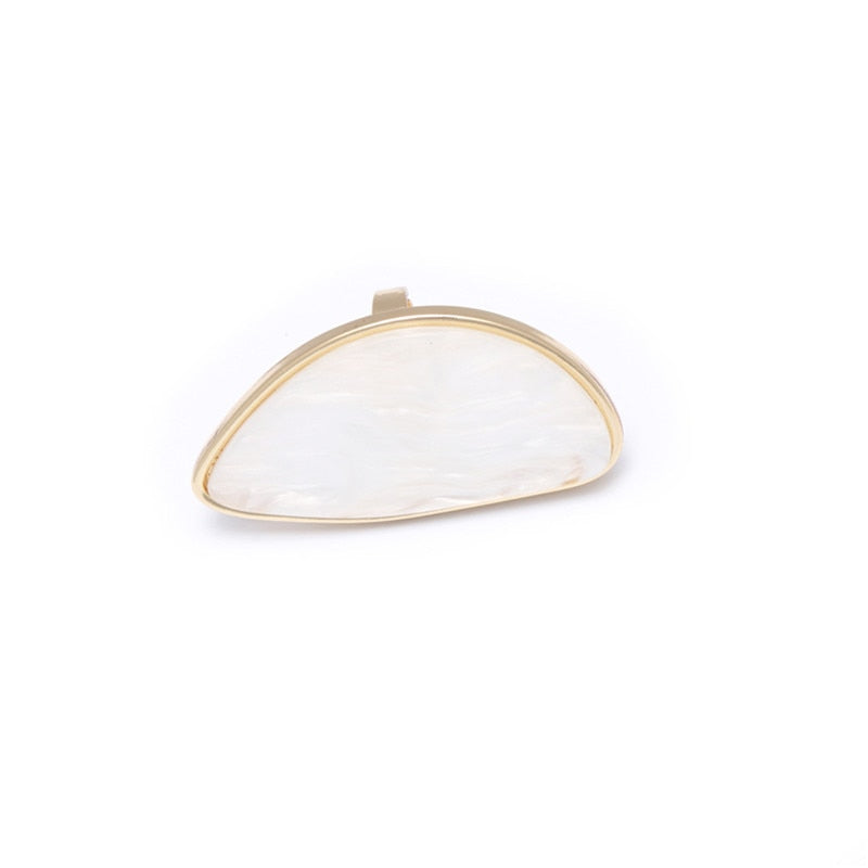 Astor geometric statement ring in marbled white acetate with an adjustable gold-tone band — view 5