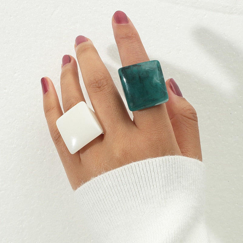 Chunky square acrylic resin rings in marbled emerald green and crisp arctic white.