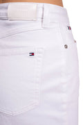 Women's white stretch denim straight shorts with five pockets and button fly on model