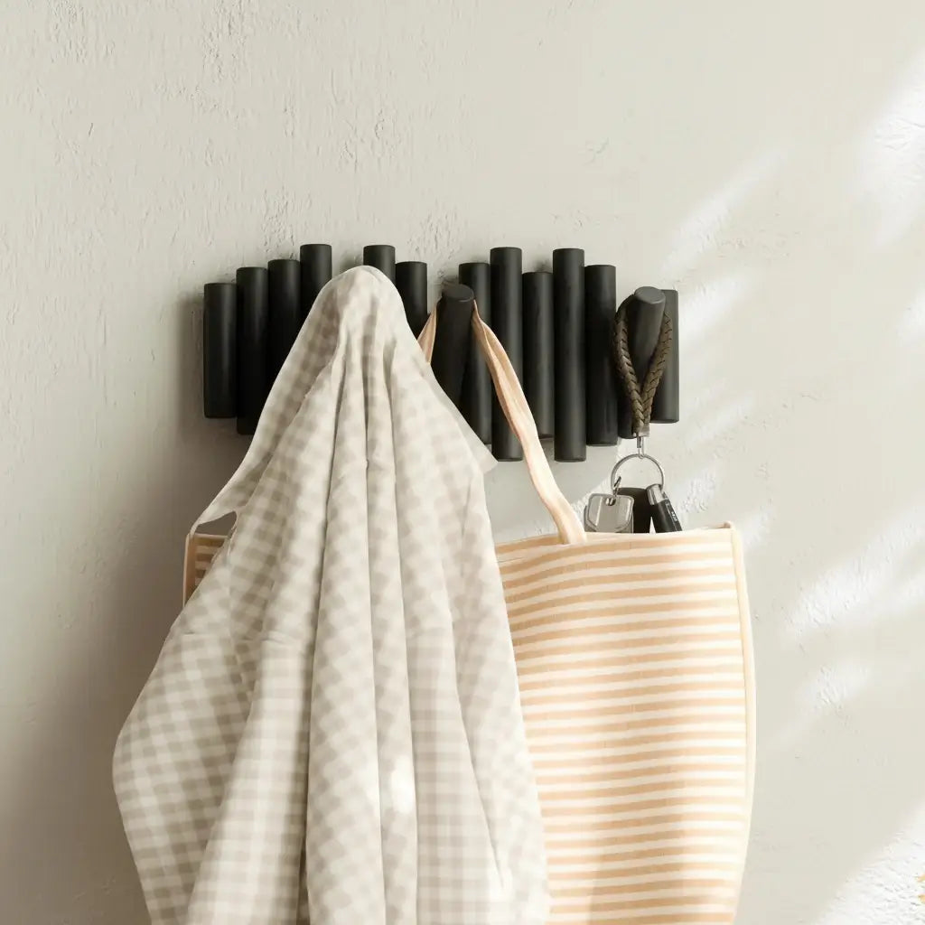 Black wall-mounted pine wood coat rack with five retractable wooden pegs for entryway storage — view 2