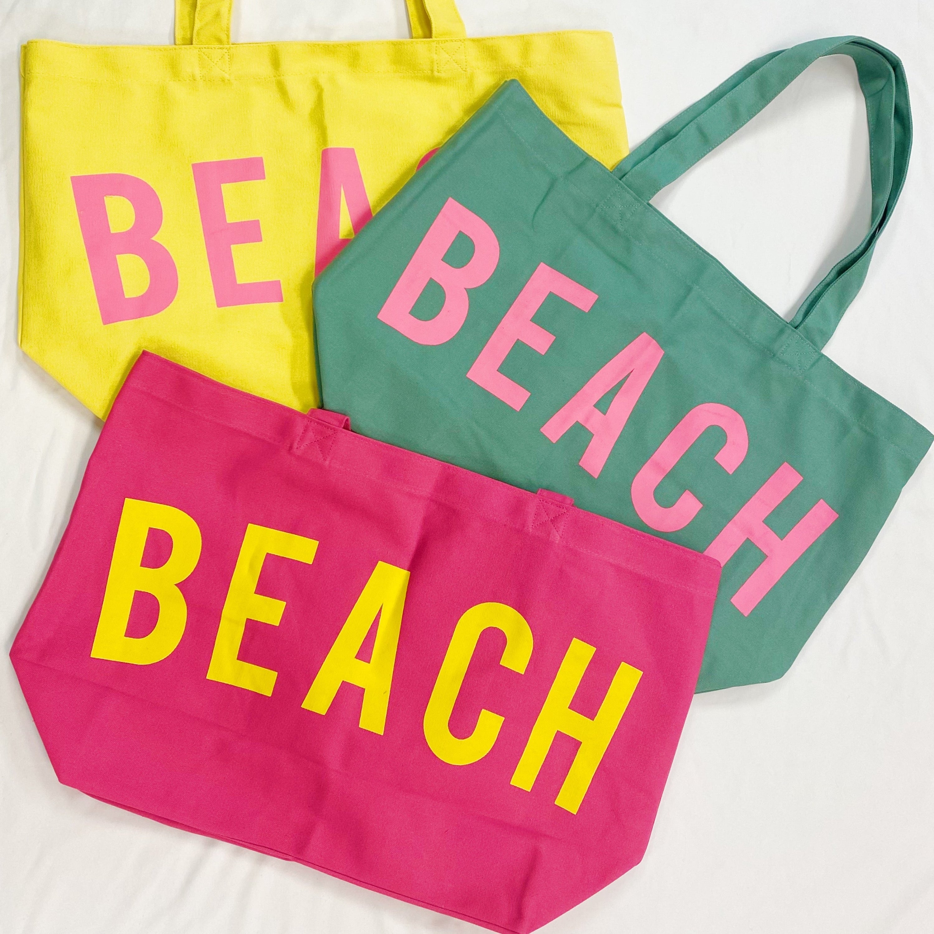 Well made beach canvas tote bag in bold color contrast with sturdy over the shoulder straps.