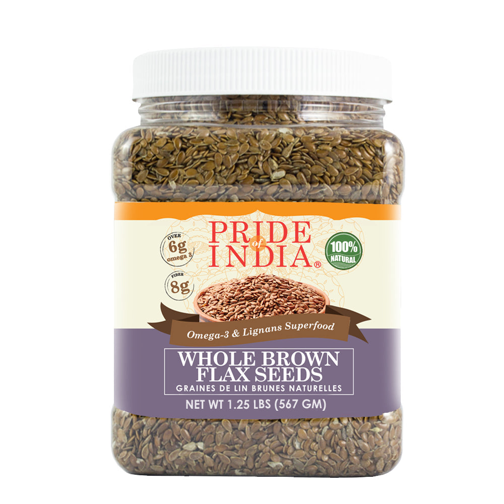 Whole brown flax seeds in a clear premium food storage jar with label