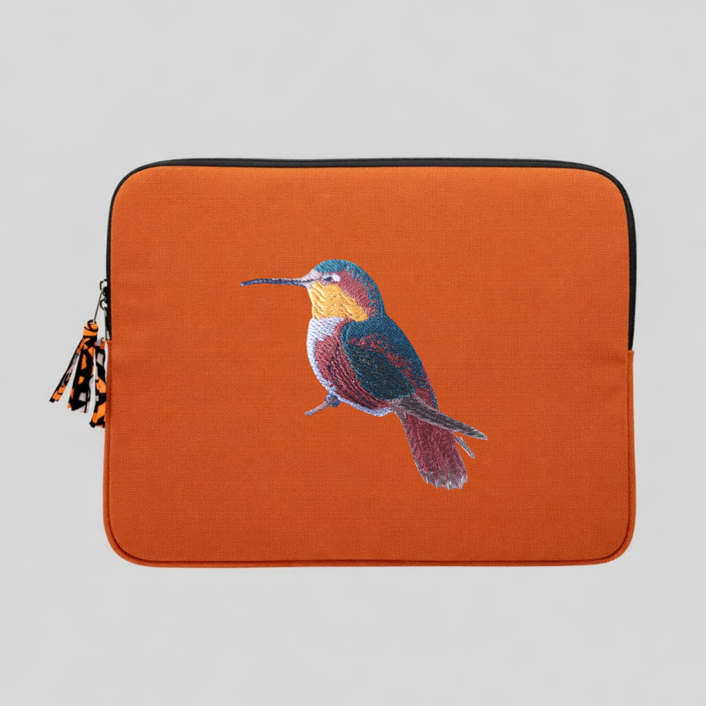 Handmade cotton canvas 13 inch laptop sleeve featuring detailed hummingbird embroidery in warm earthy tones — view 2