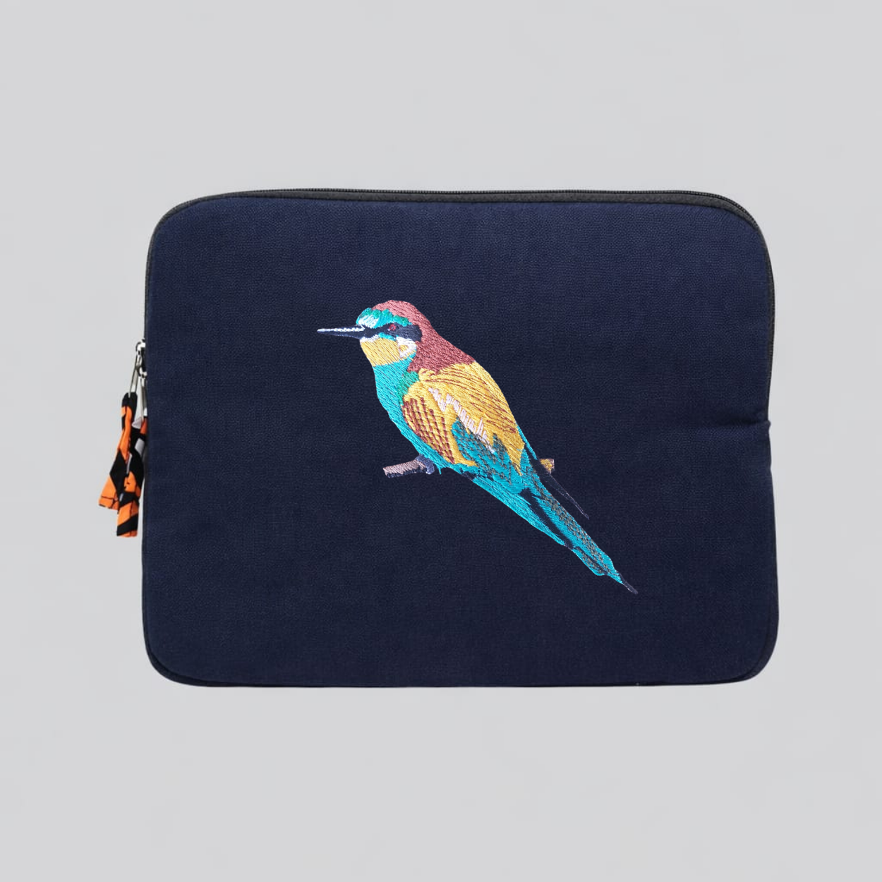 Bee eater laptop sleeve crafted from cotton canvas featuring detailed bird embroidery in earthy colors. — view 4