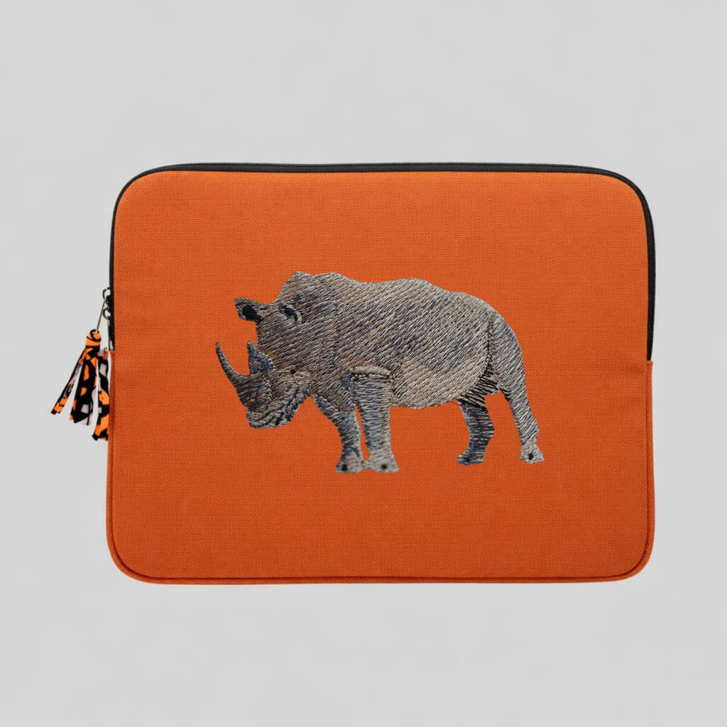 Rhino laptop sleeve made of Kenyan cotton canvas with animal embroidery in warm earthy colors — view 4