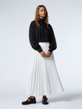NOLITA women's wrap-inspired blouse featuring a high-neck mock collar and dramatic puff sleeves