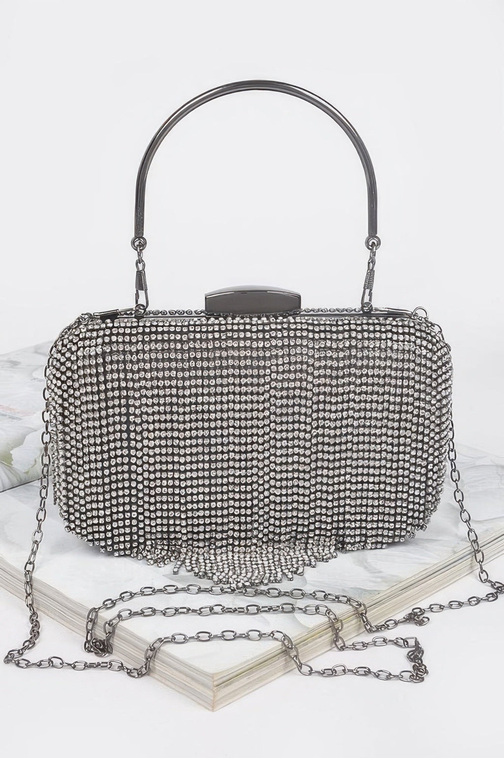 Broadway rhinestone fringe clutch handbag with hard case and shimmering metal accents for formal events
