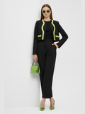 Structural black cropped jacket with bold neon green lapel detailing and straight cut design.