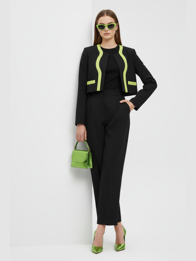 Structural black cropped jacket with bold neon green lapel detailing and straight cut design.