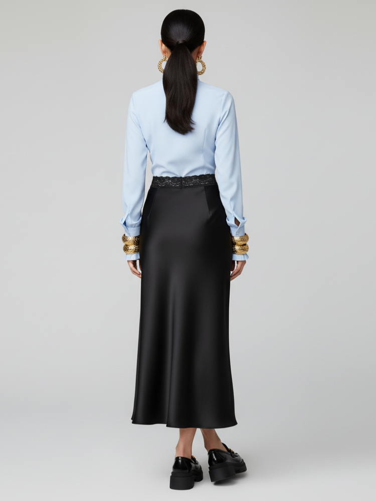 Women's deep black satin midi skirt with subtle lace waistband and fluid bias cut design — view 2