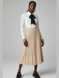 Women's nude beige pleated midi skirt made from sustainable knit fabric with an elastic waistband