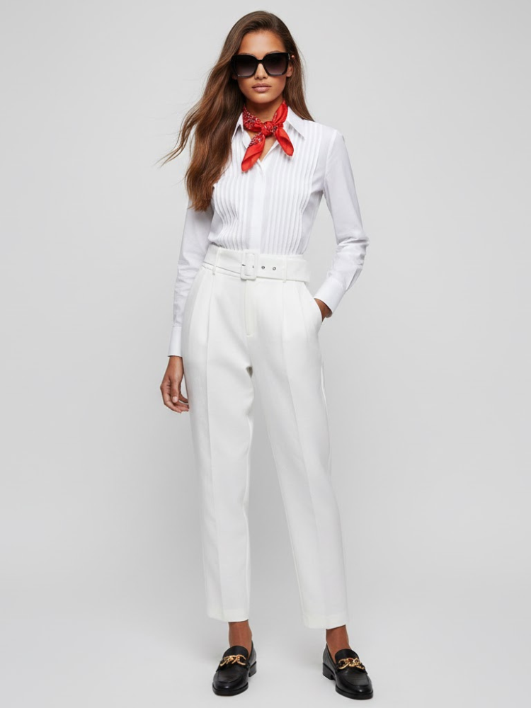 White high-waisted women's dress trousers with matching belt, front pleats, and tapered legs