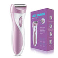 Pink women's electric razor for full-body hair removal with ergonomic handle and USB charging.