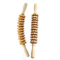 Two natural wood therapy massage rollers with ergonomic grips and rotating wooden beads