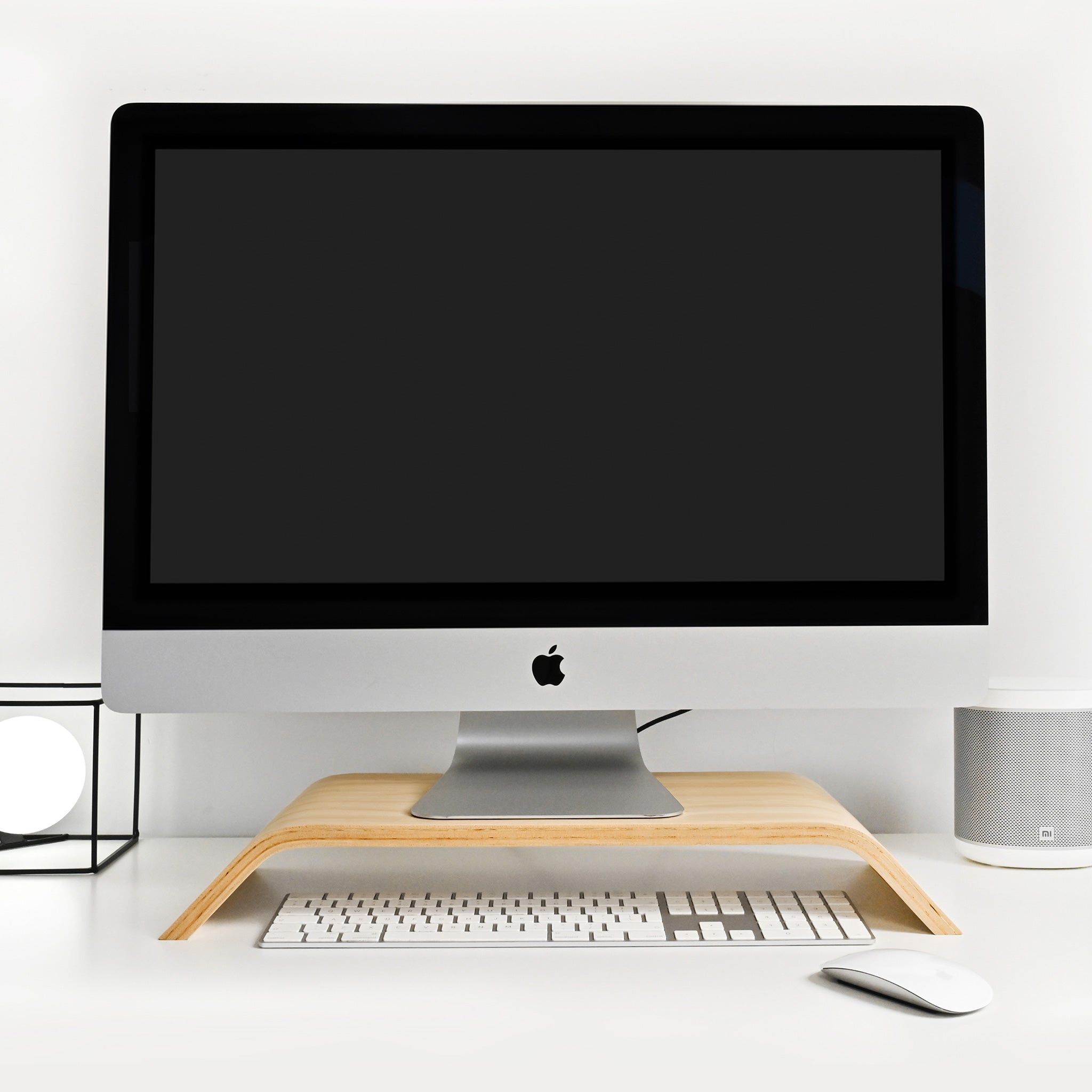 Wooden computer monitor stand riser in a minimalist Scandinavian design for neat office desk organization. — view 3