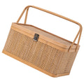 Woven bamboo picnic basket with secure locking lid, ideal for outdoor storage and elegant gifting
