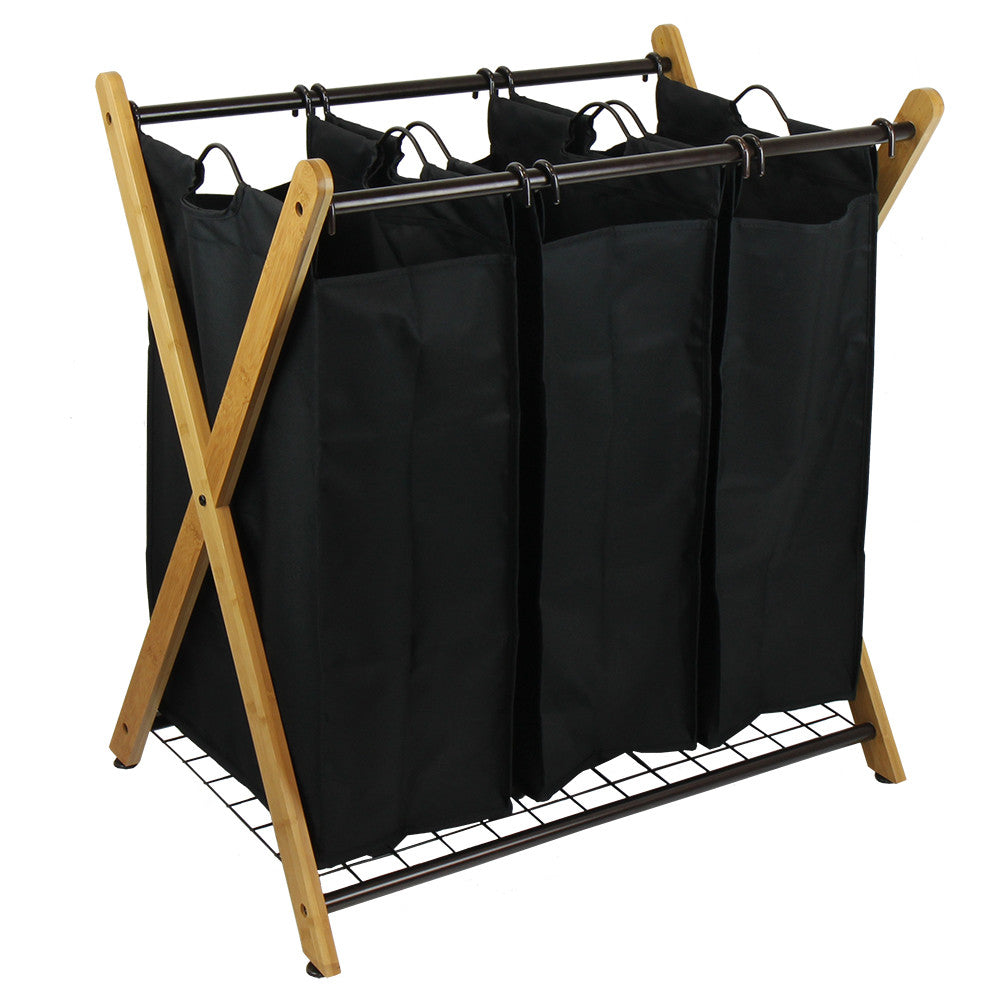 Bamboo three-bag laundry sorter with an X-frame design and black removable polyester compartments