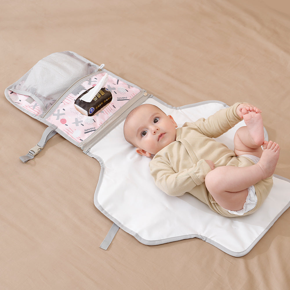 Foldable baby changing pad in durable waterproof polyester with mesh storage pockets and soft headrest. — view 5