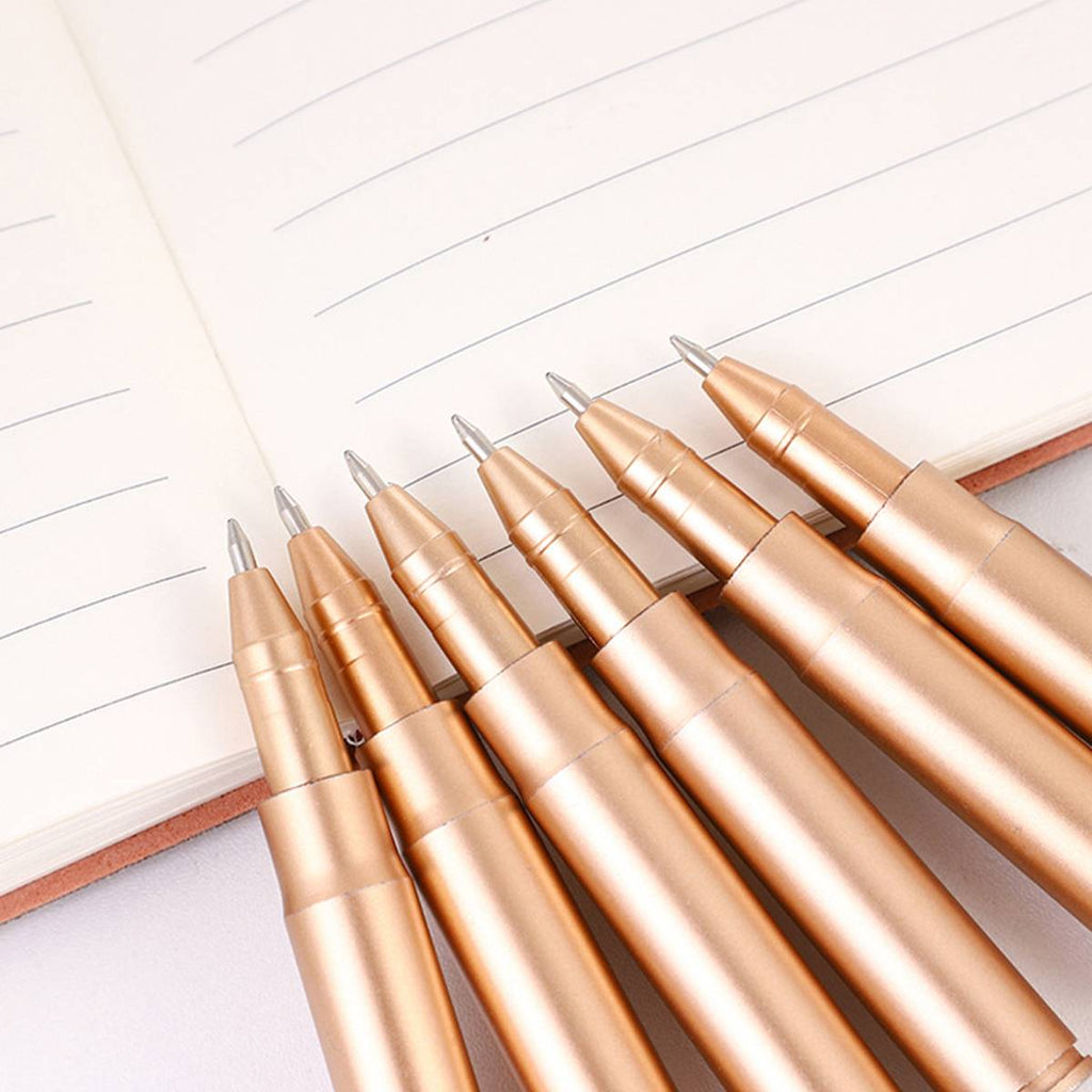 Collection of colorful novelty shape ballpoint pens scattered on a clean desk surface — view 5