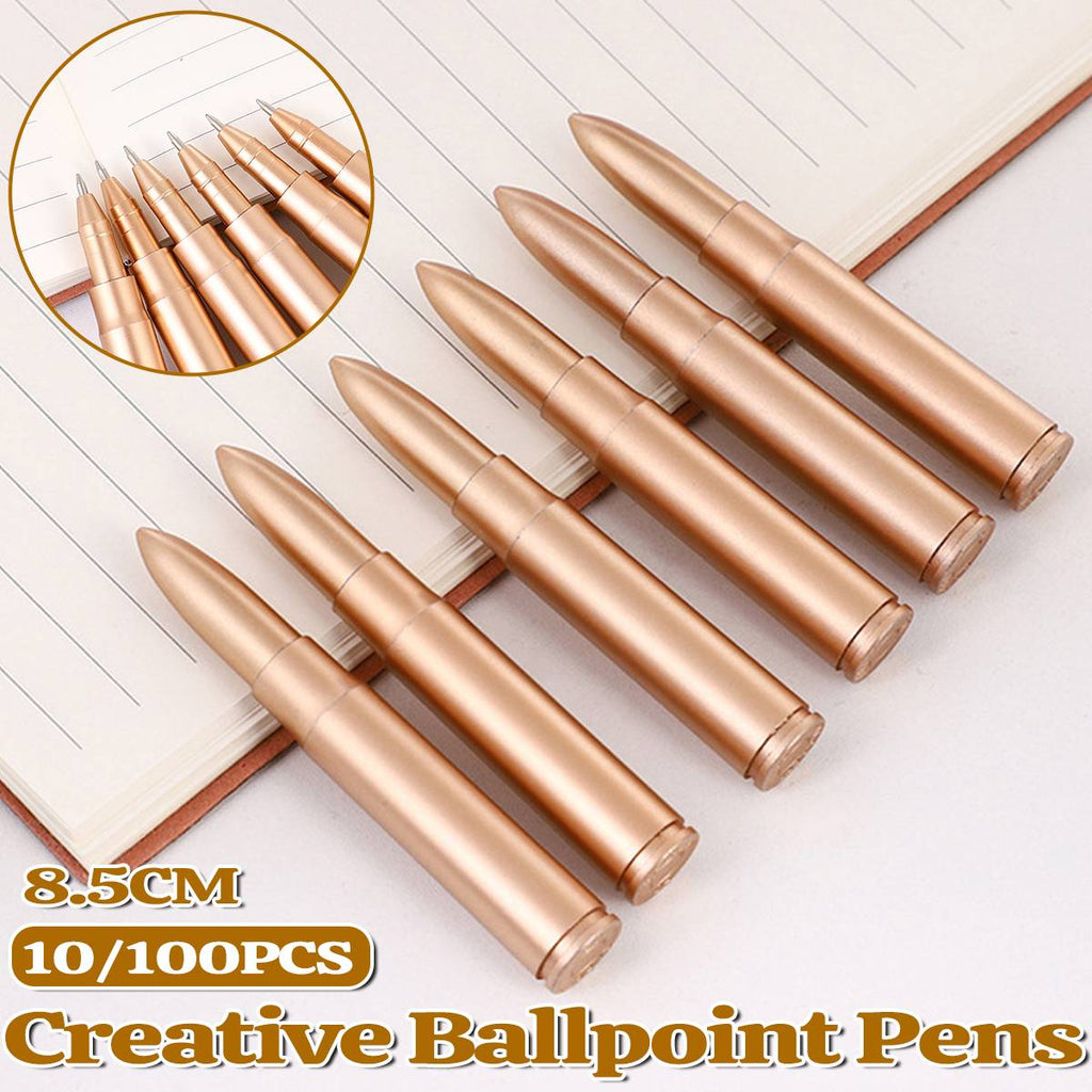 Collection of colorful novelty shape ballpoint pens scattered on a clean desk surface