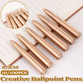 Collection of colorful novelty shape ballpoint pens scattered on a clean desk surface