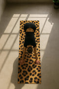 Eco-friendly leopard pattern yoga mat with non-slip textured surface and 6mm cushioning.
