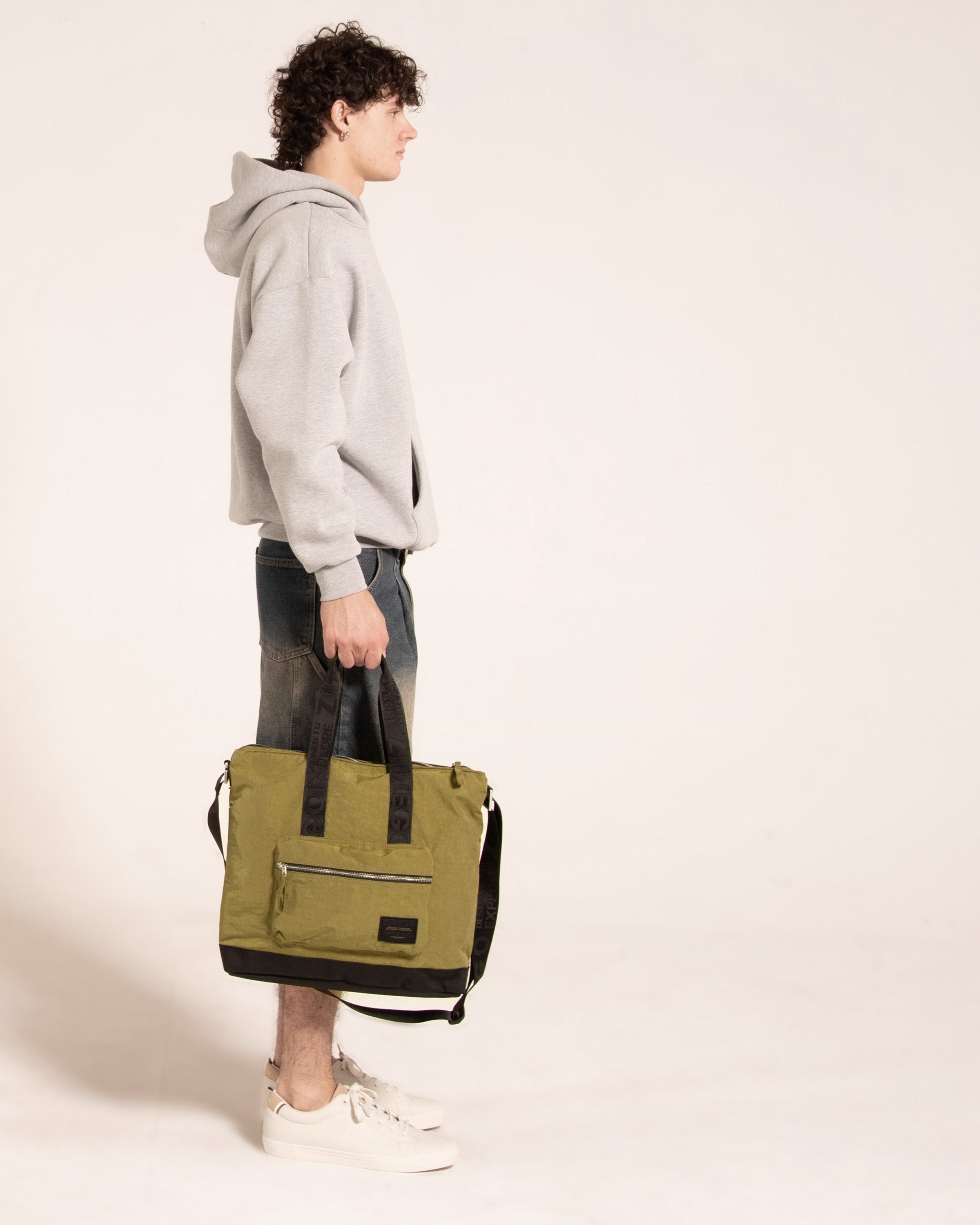 Olive green nylon unisex laptop tote bag with zip pockets and top carrying handles — view 2