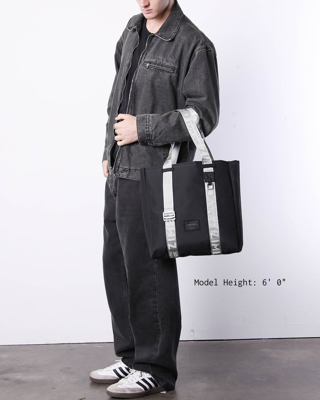 Navy blue nylon laptop tote bag with metallic silver straps and adjustable handles — view 3