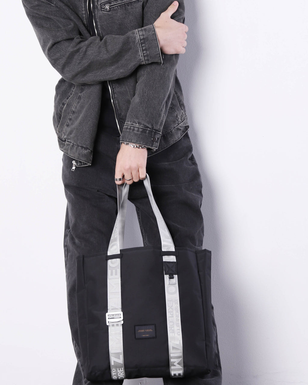 Navy blue nylon laptop tote bag with metallic silver straps and adjustable handles — view 2