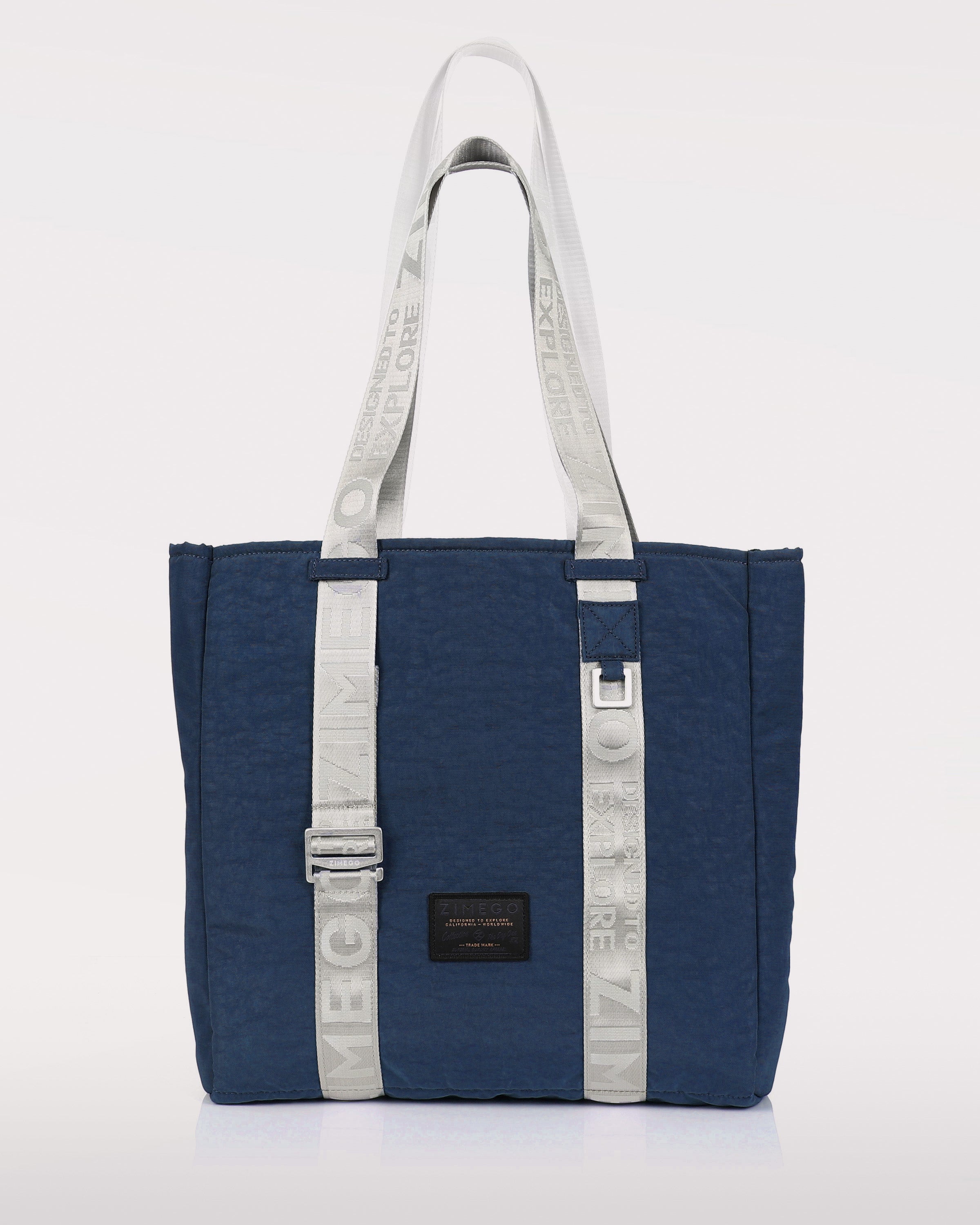 Navy blue nylon unisex laptop tote bag with adjustable metallic straps and padded tech sleeve — view 2