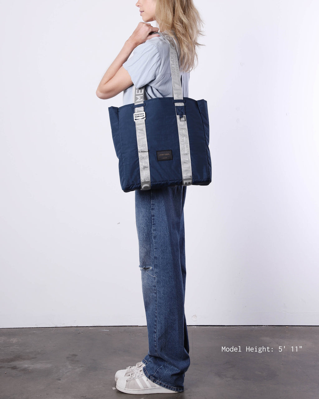 Navy blue nylon unisex laptop tote bag with adjustable metallic straps and padded tech sleeve — view 3