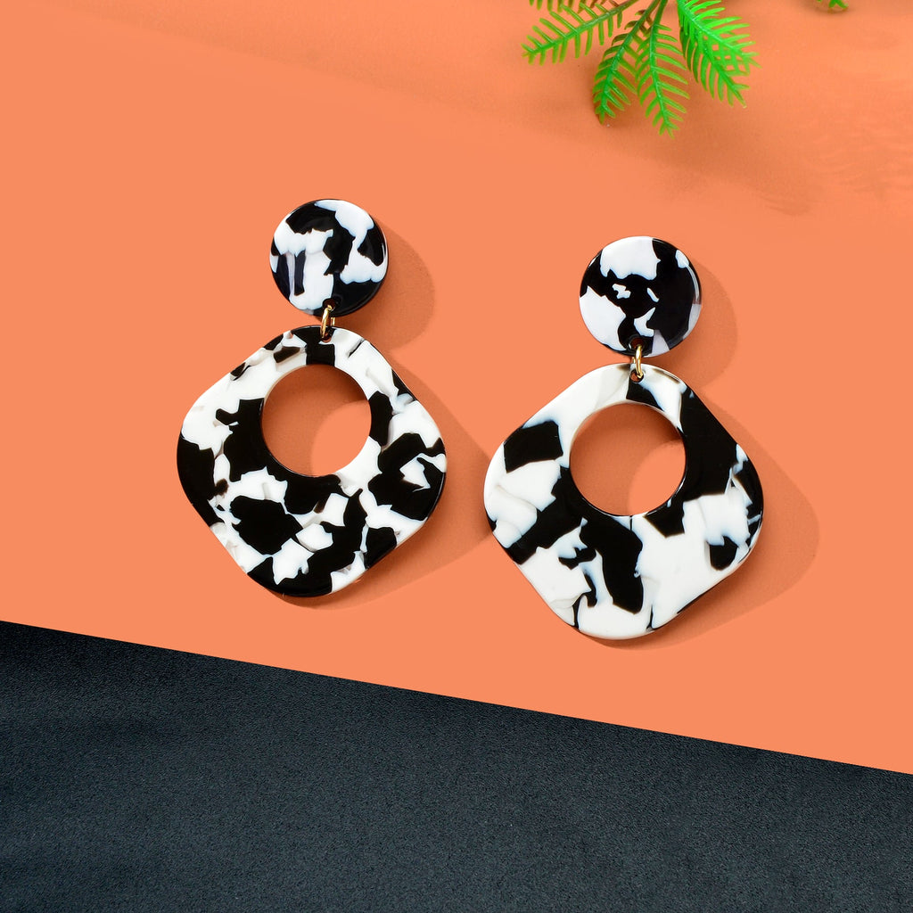 Retro black and white acrylic tortoise shell dangle earrings with round and square geometric design — view 5