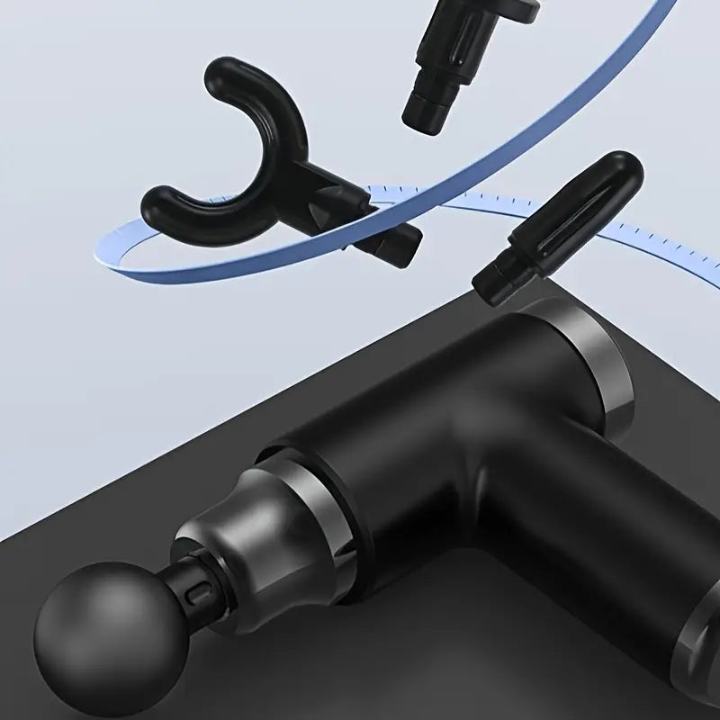 Portable black mini massage gun with four interchangeable attachment heads for deep tissue muscle recovery — view 4