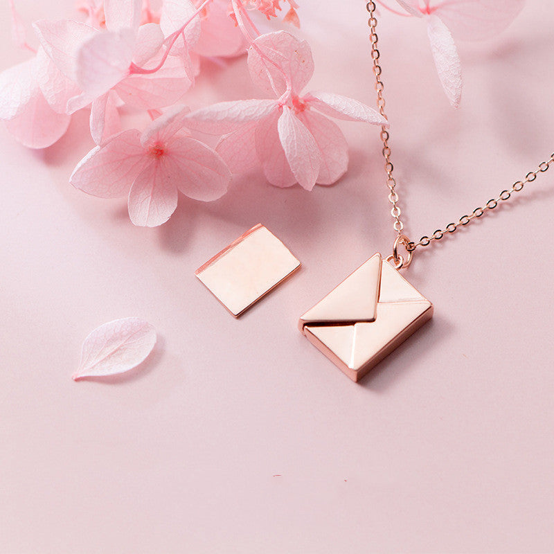 Elegant envelope locket necklace with adjustable chain, a personalized love letter keepsake in polished gold. — view 2