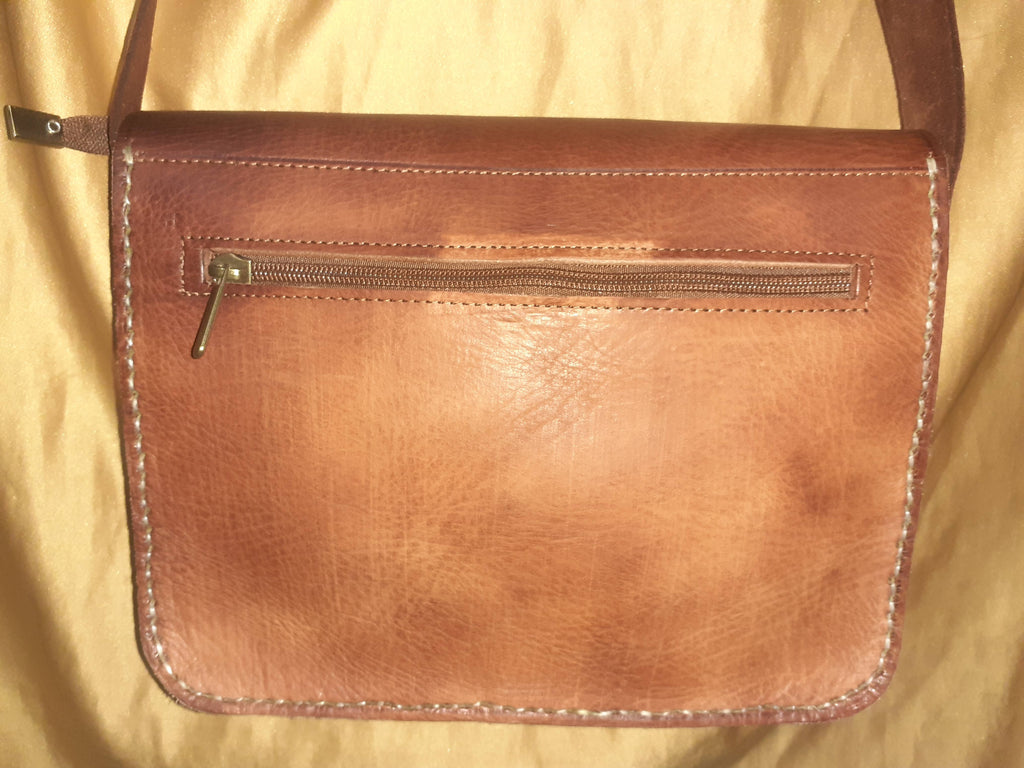 Two-tone leather crossbody bag with rustic finish, front zipper pocket, and long adjustable shoulder strap — view 7